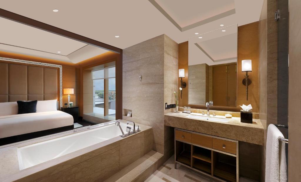 The Leela Ambience Gurugram Hotel & Residences with Bathtub The Leela Ambience Gurugram Hotel & Residences with Bathtub